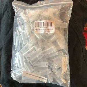 Bag of mini perfume, cleanser, toner, moisturizer, sample bottles - Empty